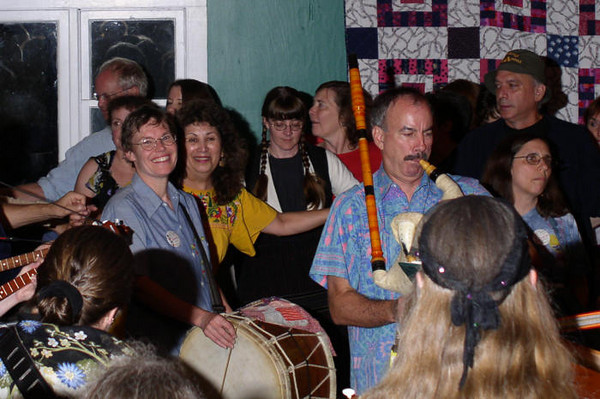 photo of Sandy playing tupan, Aug 2003